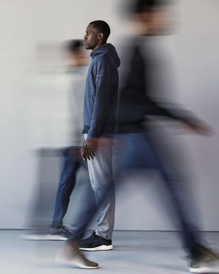 a blurry photo of two men walking