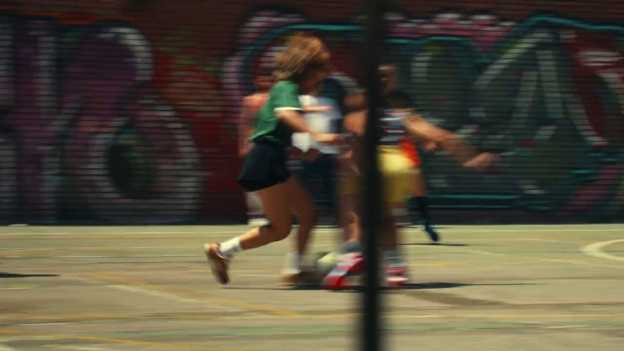 a group of people playing a game of soccer