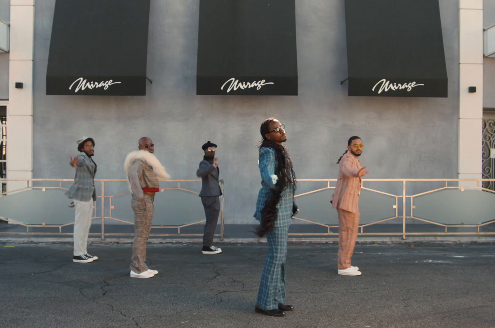 a group of people standing in front of a building