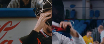 a man holding a hockey helmet up to his face