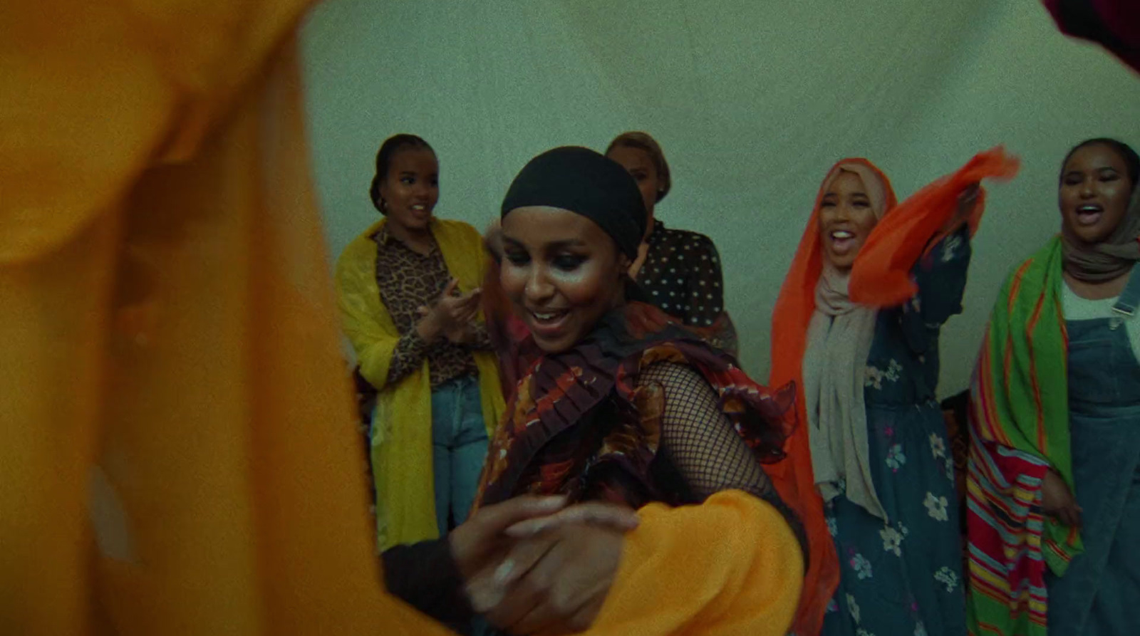 a group of women standing next to each other