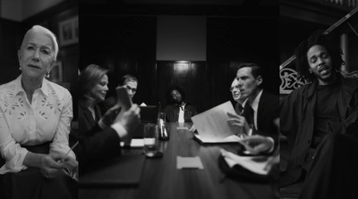 a group of people sitting around a wooden table