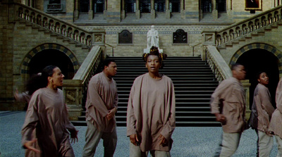 a group of people standing in front of a building