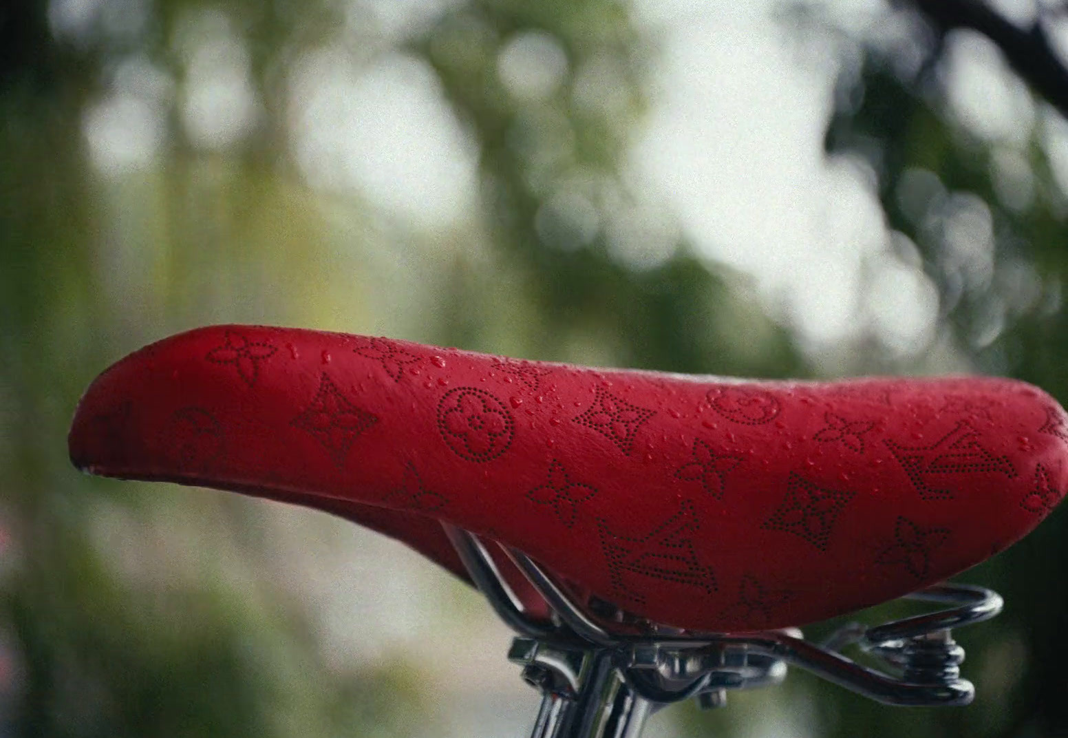 a close up of a red bicycle seat