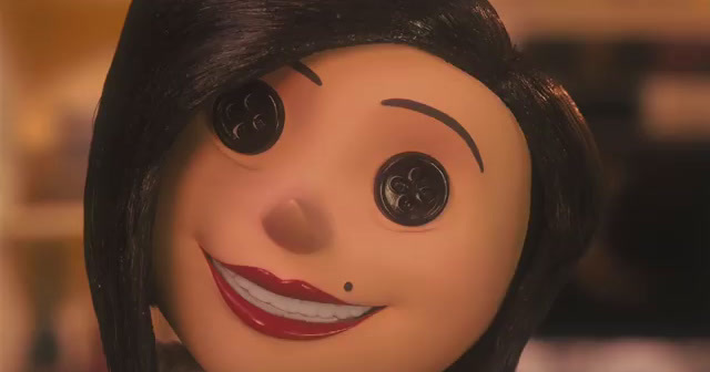 a close up of a doll's face with black hair