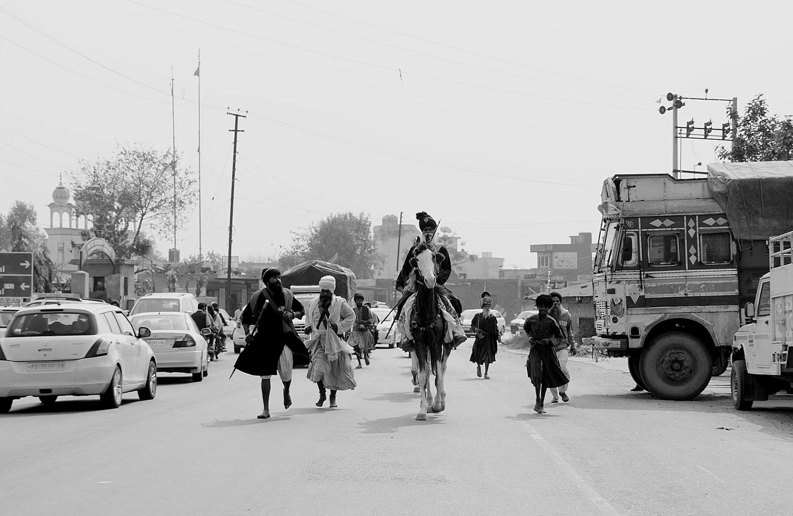 a group of people walking down a street