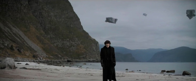 a man standing on top of a sandy beach