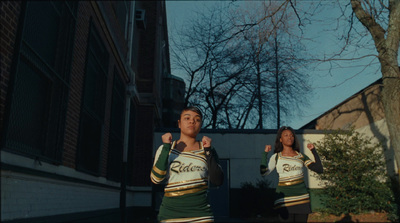 a couple of people that are standing in the street