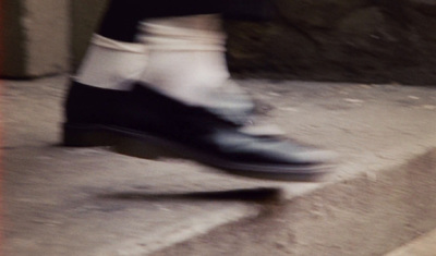 a close up of a person's feet on a skateboard