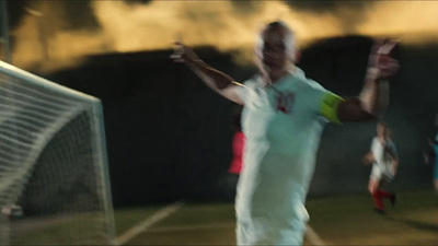 a blurry photo of a man on a soccer field