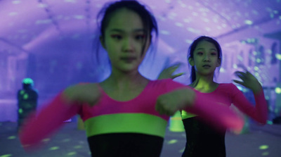 two young women are dancing in a dance studio