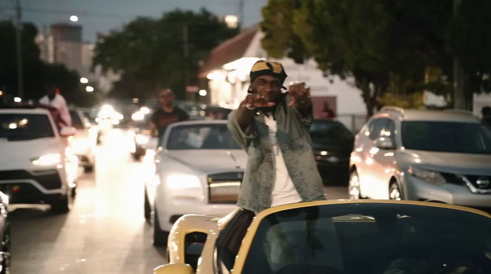 a man taking a selfie in the middle of a busy street