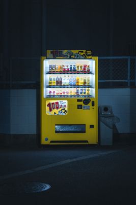 a vending machine sitting on the side of a road