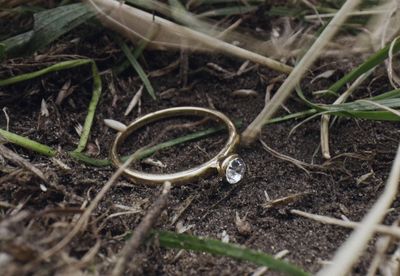 a pair of wedding rings laying on the ground