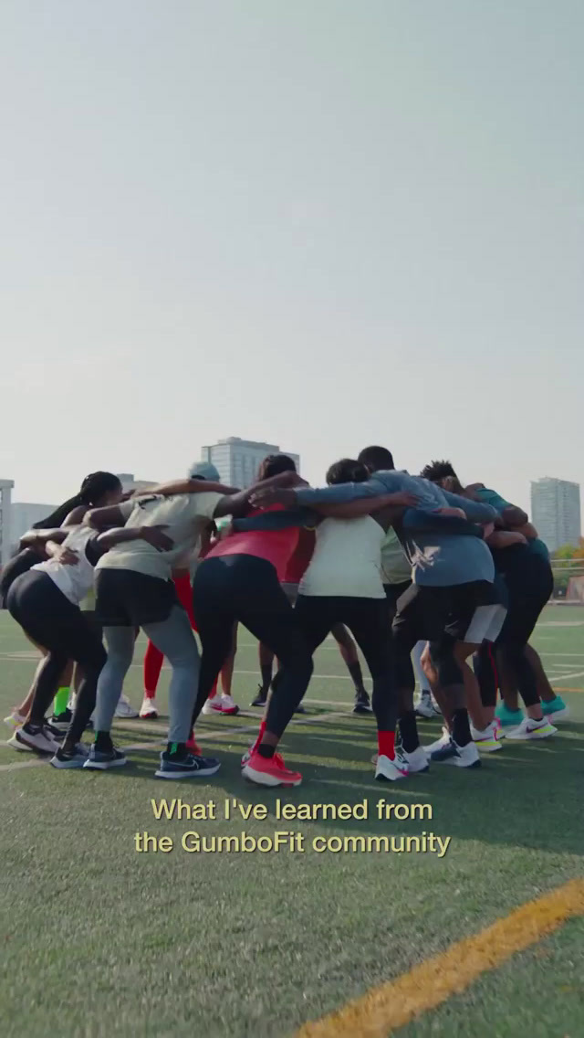 a group of people standing on top of a field