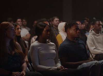 a group of people sitting next to each other