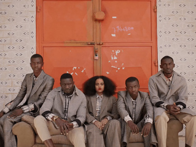 a group of people sitting on top of a couch