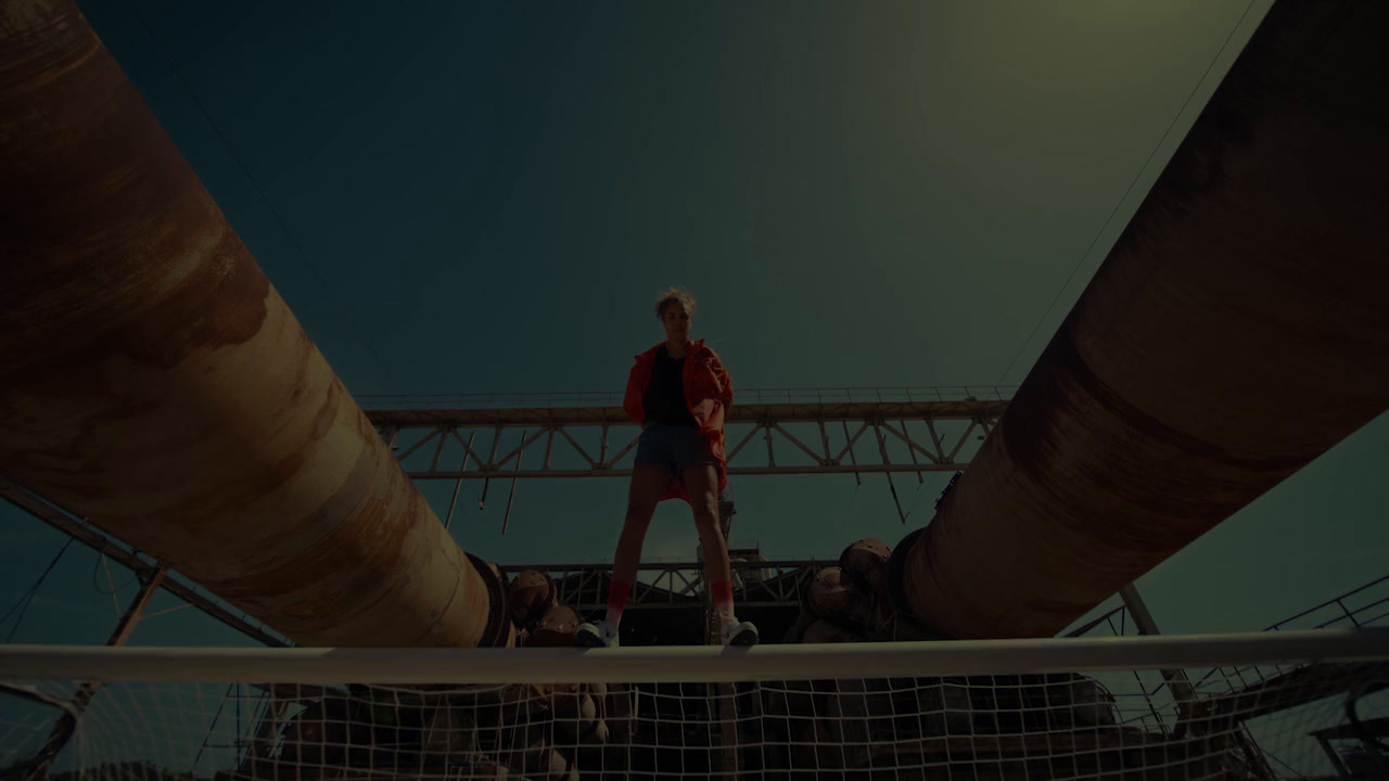 a man standing on top of a tennis court next to a net