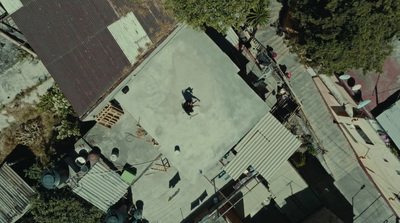 a group of people standing on top of a roof