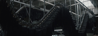 a room filled with lots of black clothes