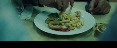 a white plate topped with fries and a sandwich