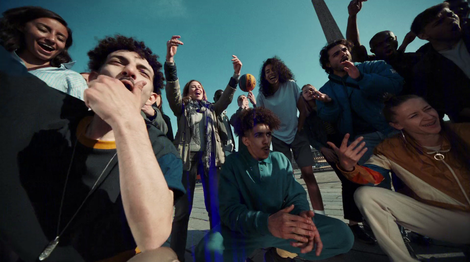 a group of young men sitting on the ground