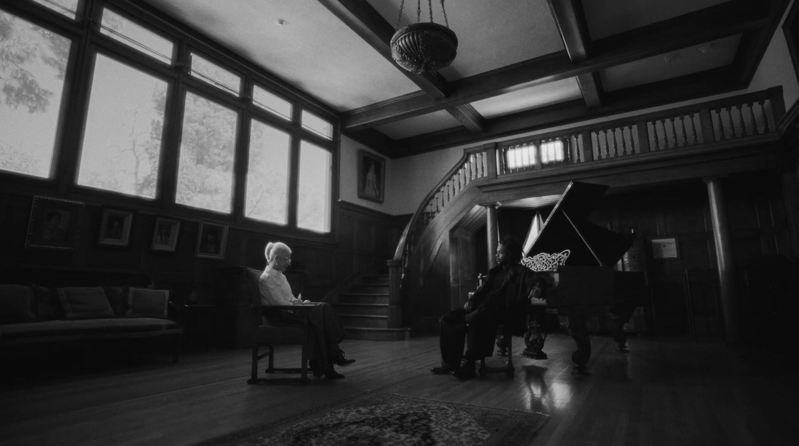 a man and a woman sitting in a large room