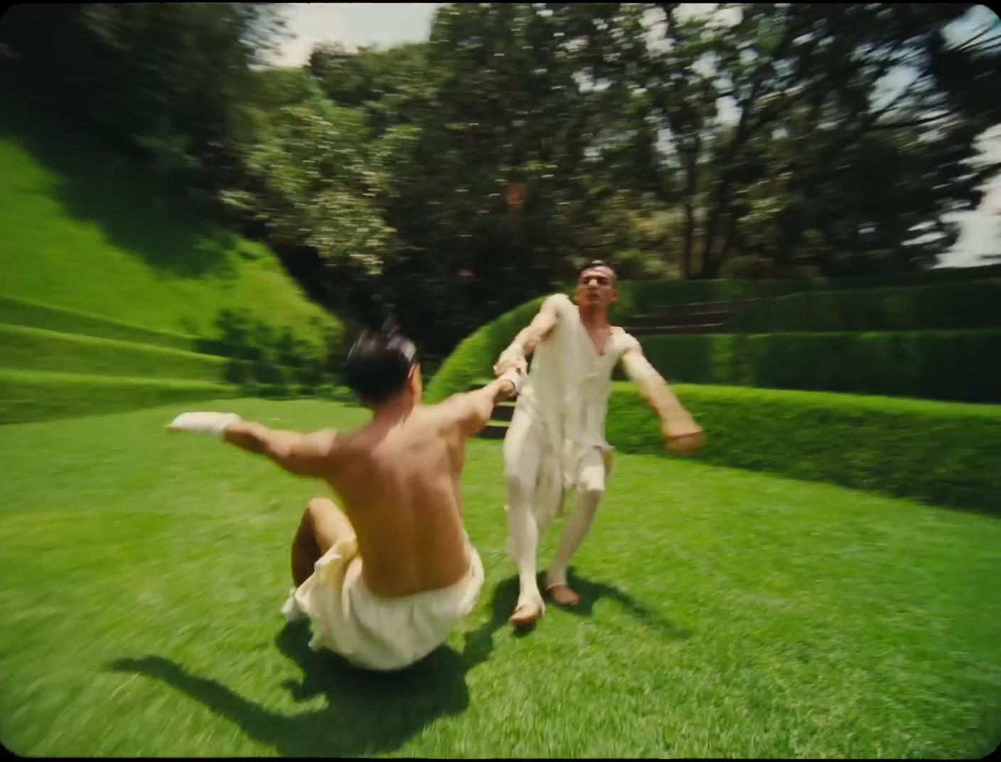 a couple of men playing a game of frisbee