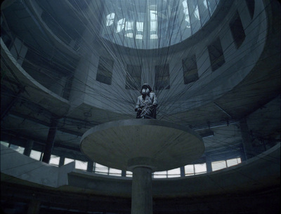 a person sitting on a large object in a building