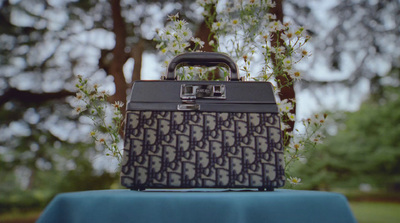 a suitcase sitting on top of a blue table