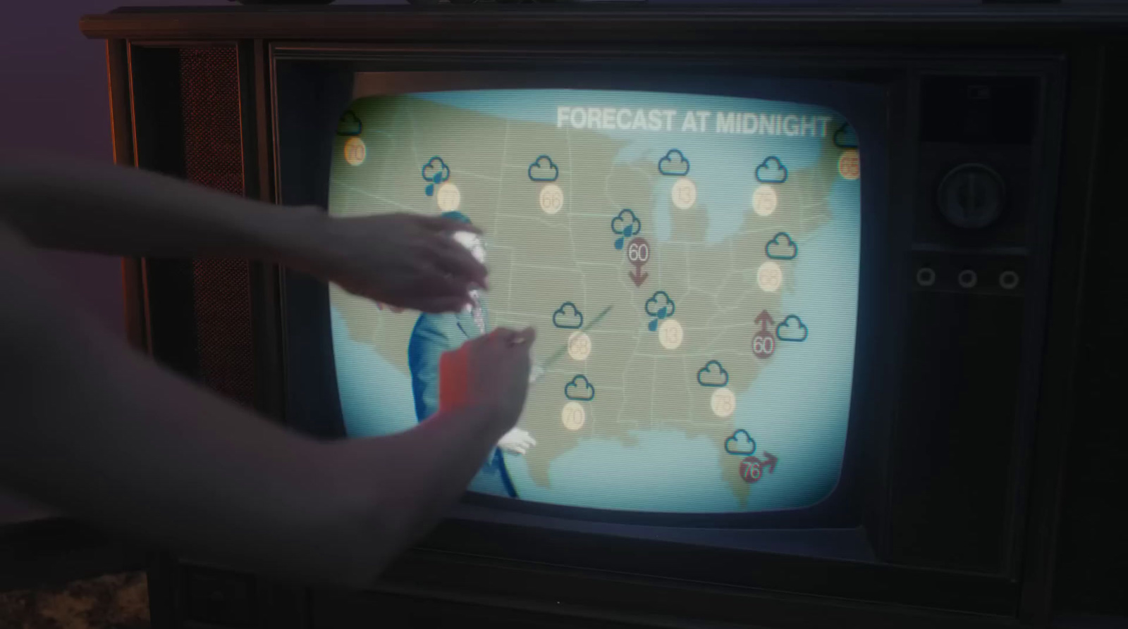 a person is playing a game on a television