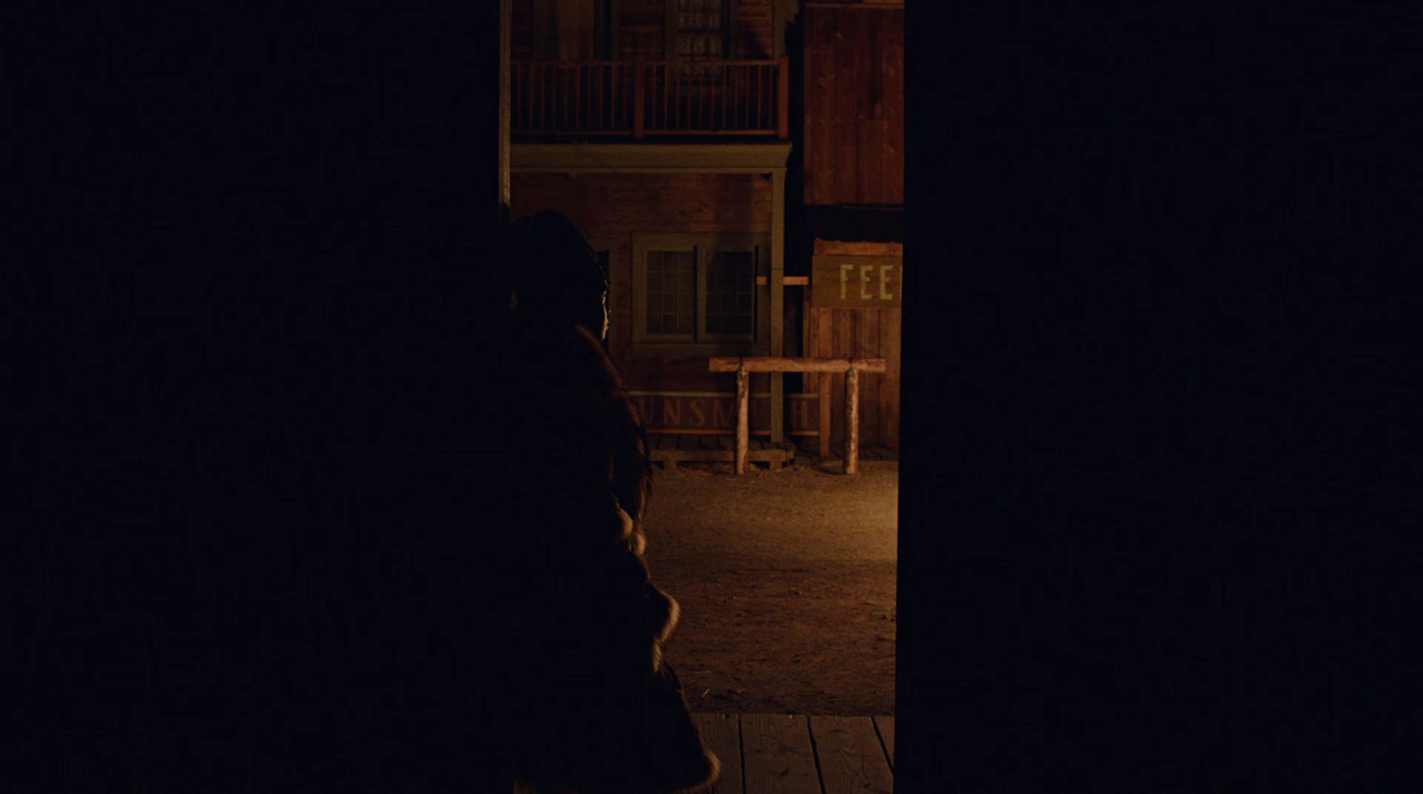 a person standing on a porch at night