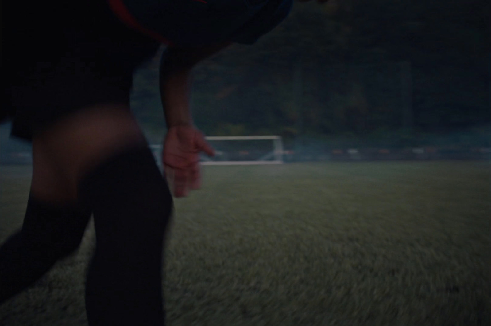 a blurry photo of a person holding a frisbee