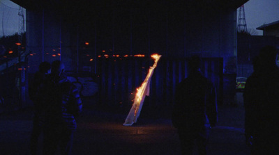 a group of people standing next to each other in the dark