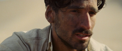 a close up of a person wearing a white shirt