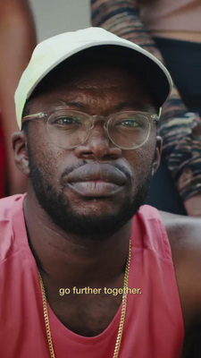 a man wearing glasses and a hat