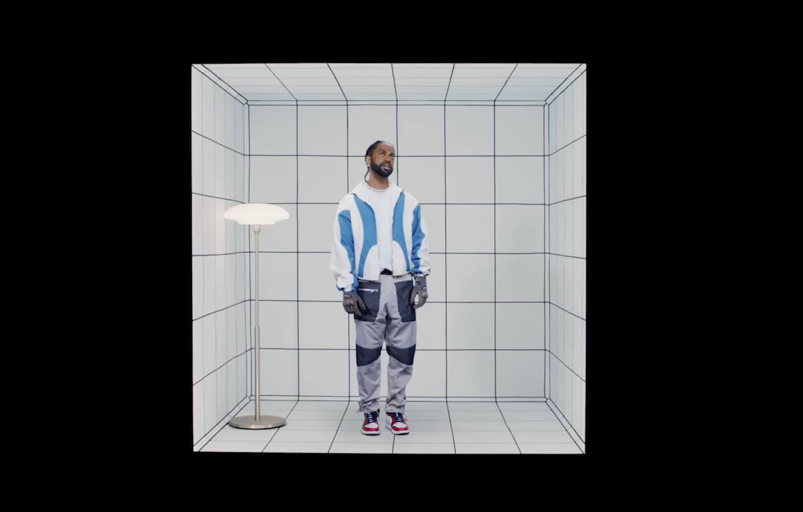 a man standing in a white tiled room