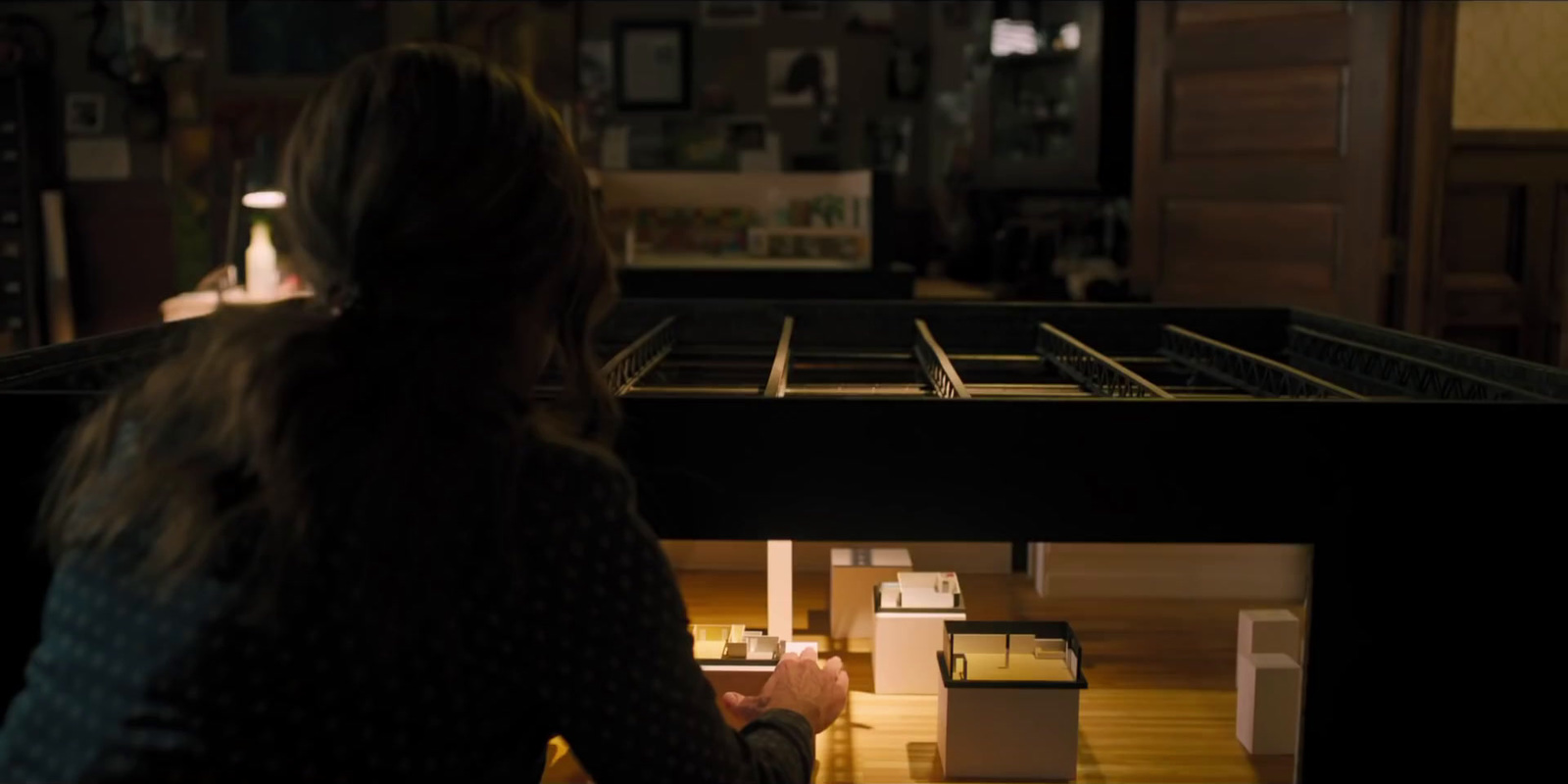 a woman standing in front of a table in a room