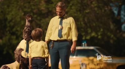 a man standing next to two little boys