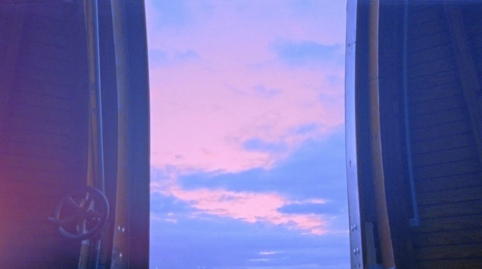 a view of the sky through two windows