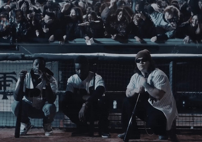 a baseball player holding a bat in front of a crowd