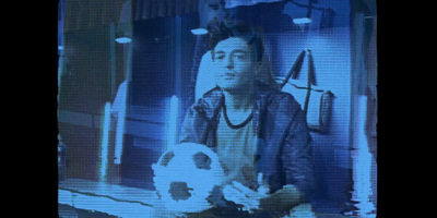 a man holding a soccer ball in his hand