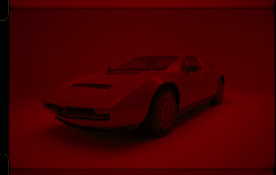 a white sports car in a red background