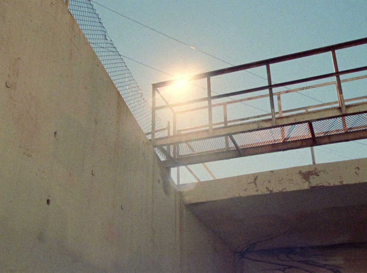 a person riding a skateboard on a bridge