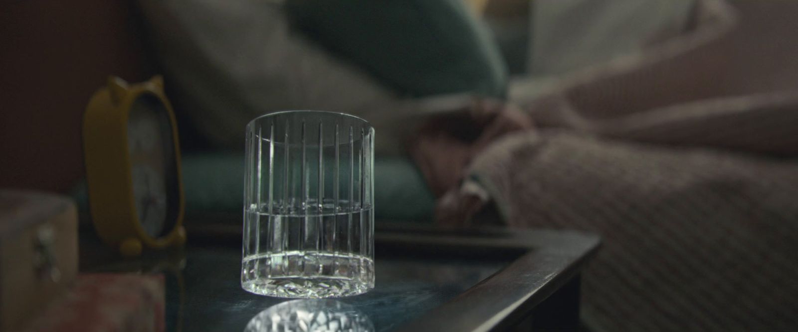 a clear glass sitting on top of a table