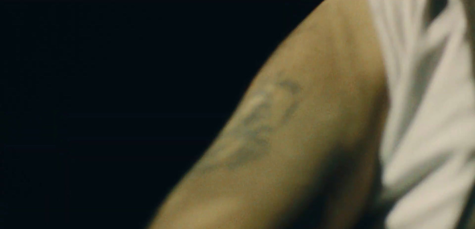 a man with a tattoo on his arm