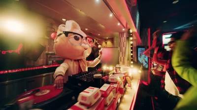 a person standing in front of a counter in a restaurant