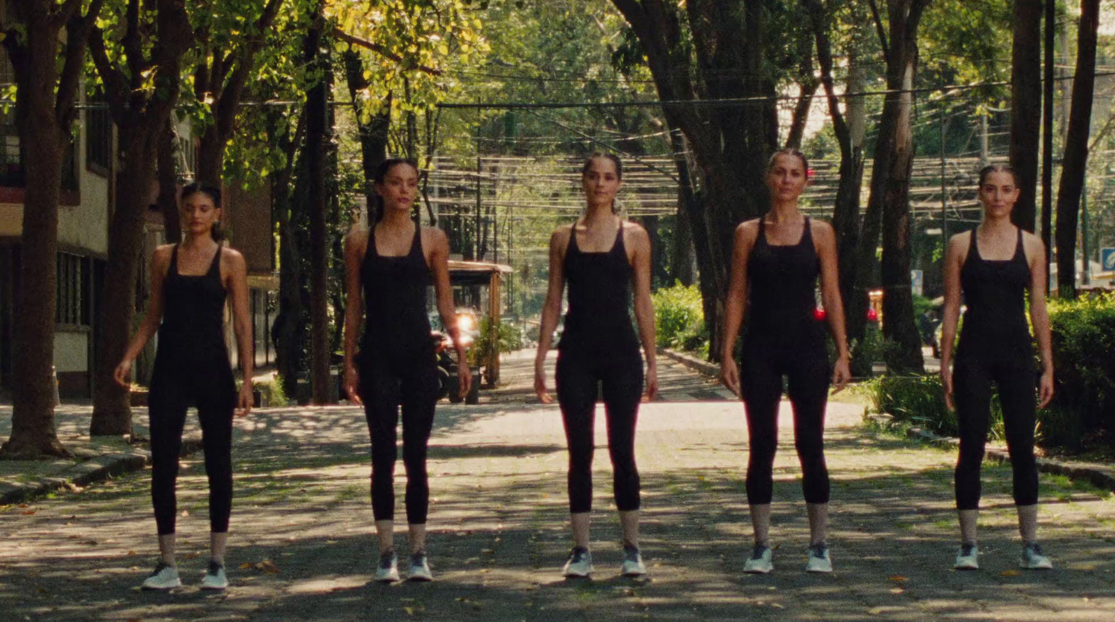 a group of young women standing next to each other