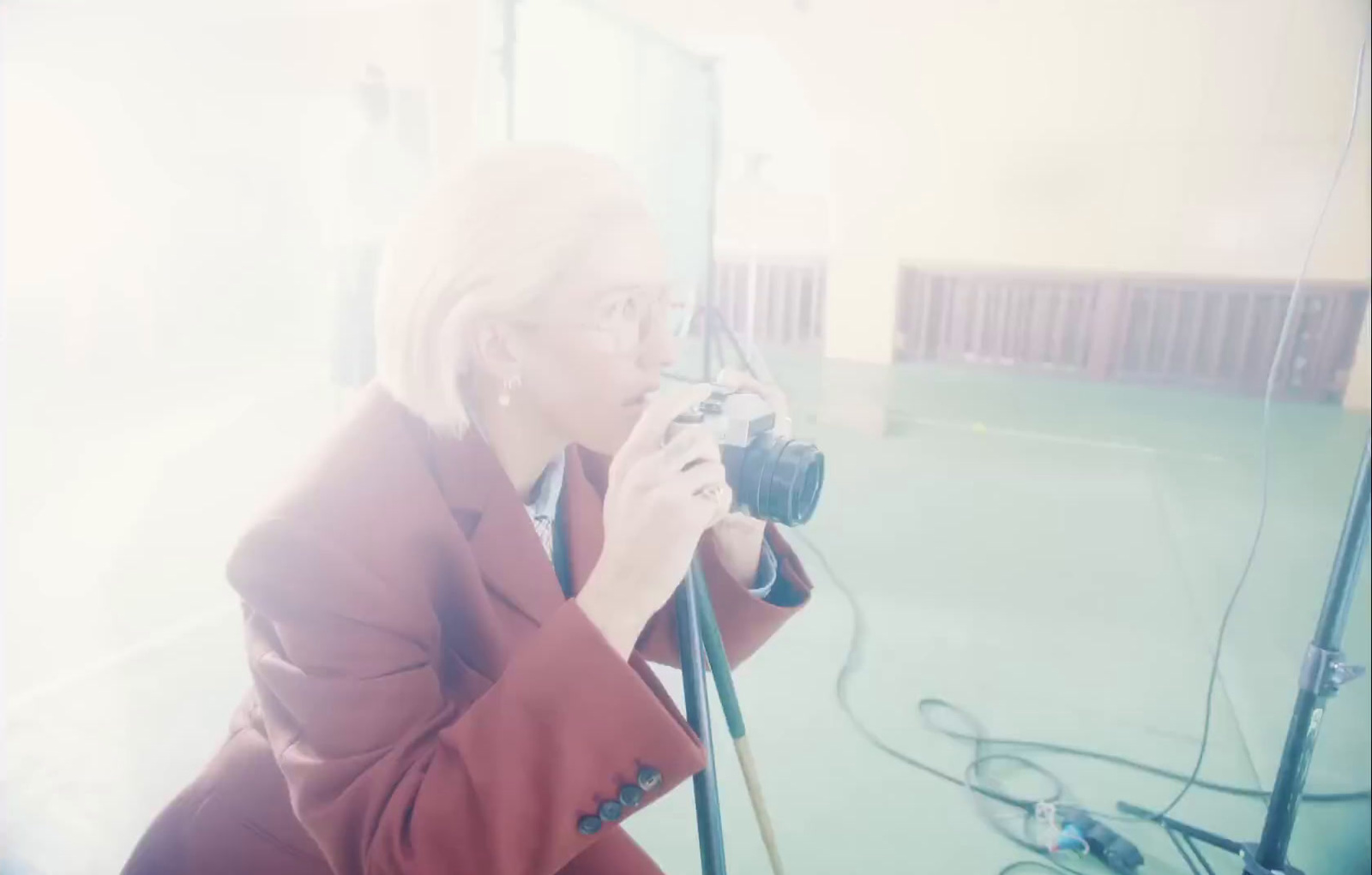 a woman taking a picture of herself with a camera