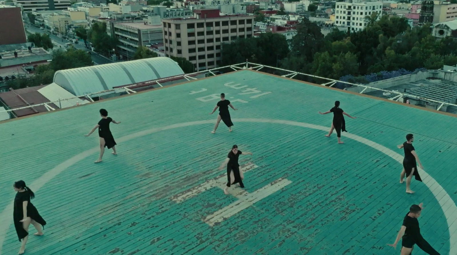 a group of people standing on top of a roof